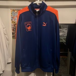Blue and orange polyester Puma NYC jacket size medium. Worn less than 5 times.